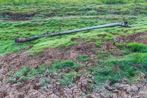 Grass, pumping iron pipe photo