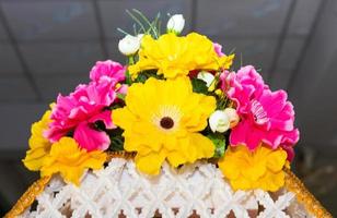 Bouquet of artificial flowers in pink yellow. photo