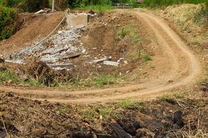 Rural dirt road ditch photo