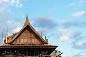 Thai roof scaffolding sky cloud. photo