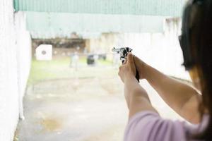 women shooting target photo