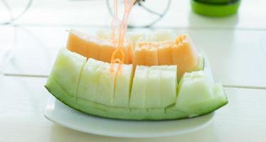 Juicy slice cantaloupe melon photo