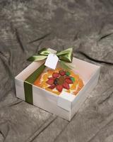 Lebaran parcels or Hampers, usually distributed at the moment of Eid. The packaging box contains a beautiful and attractive jelly cake. Also suitable for birthday cakes. Eid greetings. Focus Blur. photo