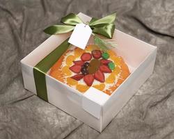 Lebaran parcels or Hampers, usually distributed at the moment of Eid. The packaging box contains a beautiful and attractive jelly cake. Also suitable for birthday cakes. Eid greetings. Focus Blur. photo