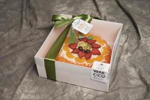 Lebaran parcels or Hampers, usually distributed at the moment of Eid. The packaging box contains a beautiful and attractive jelly cake. Also suitable for birthday cakes. Eid greetings. Focus Blur. photo