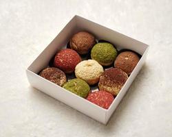 Craquelin choux is a Japanese eclairs with a crispy coating that tastes sweet and creamy. Creampuffs containing various flavors of fla, vanilla, chocolate, matcha. Eid hampers or parcels. focus blur. photo