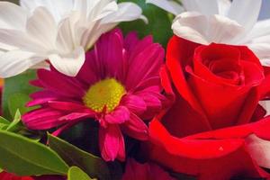 Assortment of bright flowers in an arrangement. photo