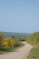 Back country road on the Canadian prairies in fall. photo