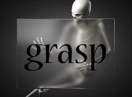 grasp word on glass and skeleton photo