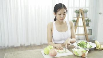 Female blogger leads online course on healthy eating, talking in front camera on social networks. Fitness woman records training on vegetarian cooking Distances diet through smartphone video tutorial