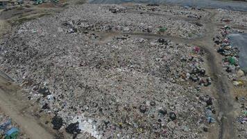 Aerial view over huge pile of garbage or waste waiting for recycle or for produce electrical in electrical power plant. Sustainable energy environment conservation concept. video