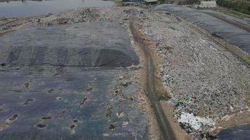 Aerial view over huge pile of garbage or waste waiting for recycle or for produce electrical in electrical power plant. Sustainable energy environment conservation concept. video