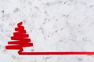 Christmas tree made of ribbon on white background. photo