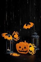 Halloween background with spider, bats, pumpkins and lantern. Halloween holiday background. photo