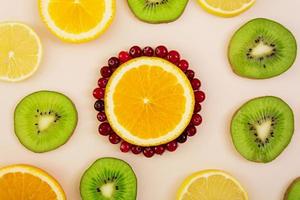 Fruit texture. Background of various sliced fruits photo