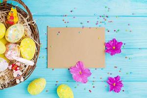 Easter background with flowers and easter eggs. Top view