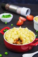 Homemade shepherd's pie on wooden background photo