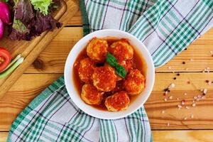 Meatballs on wooden background photo