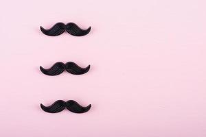 Fake black mustaches. Happy Fathers day. Background of fathers day. Top view. Flat lay. photo