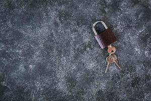 Iron lock with keys on grey background. Top view. photo