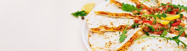 Delicious quesadilla with chicken, corn and salsa. Banner. photo