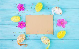 Easter background with flowers and easter eggs. Top view