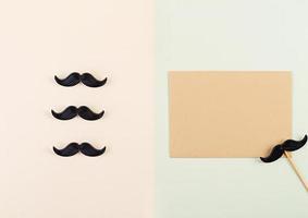 Mockup with blank paper and mustaches. Happy Fathers day. Background of fathers day. Top view. Flat lay. photo