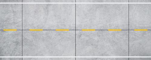 Top view empty concrete road and white and yellow dividing lines background. photo