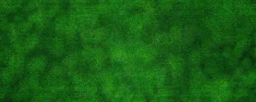 Panorama green artificial grass texture background for decorating the interior or exterior of the garden at home.