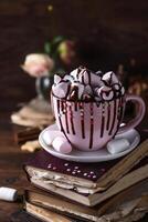 Mug with marshmallows poured with chocolate