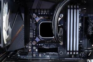 cooling pump on cpu socket and quad channel ram ddr4 that installed on modern mainboard photo