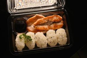 Grilled fish with rice balls photo