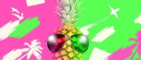 Creative pineapple with sunglasses on summer background. photo