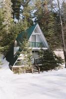 Cabin in the woods in winter photo