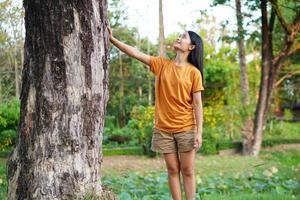 Asian women huging trees , the concept of love for the world photo