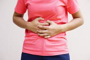 Woman suffer from stomachacheChronic gastritis Abdomen bloating concept photo