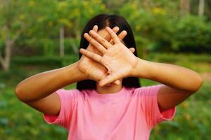 Woman raised her hand for dissuade, campaign stop violence against women photo