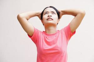 Asian women suffer from work stress. Put your hand on your head photo