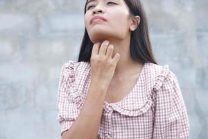 women itchy neck skin photo