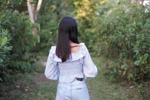 Female tourist on the mountain looking at nature photo