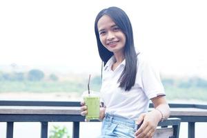 Asian woman smiling happily in a cafe photo