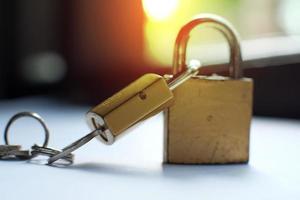 Two padlocks locked with each other photo