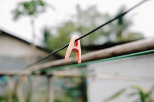 Cloth clip, Clothespins on a clothesline rope photo