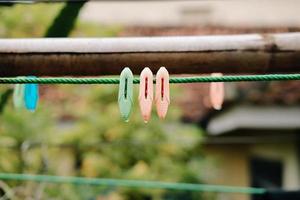 Cloth clip, Clothespins on a clothesline rope photo