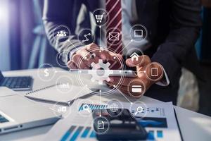 Businessman working with smart phone and laptop and digital tablet computer in  office with digital marketing media  in virtual icon photo