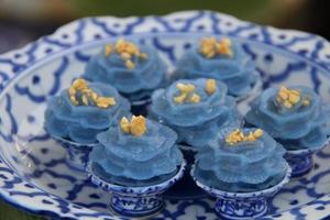 Chor Muang, Flower Shaped Dumpling filled with Minced Chicken are on Thai ancient style plate and on top with fried garlic, Thailand. Chor Muang is Thai ancient appetizer. photo