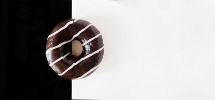 Top view, chocolate donut on black white background. photo