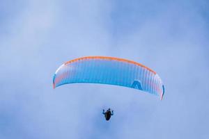 Tenerife, Spain, 2015.  Person hang gliding over the sea photo