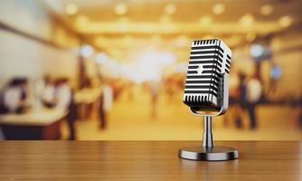 Close up of old vintage style podcast microphone in convention hall and blurry people background. Entertainment and conference concept photo