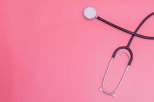 stethoscope on pink background and copy space photo